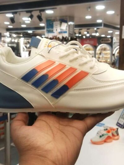 athletic shoe with blue and orange strips accents displayed in a store, ideal for morning walks and running.