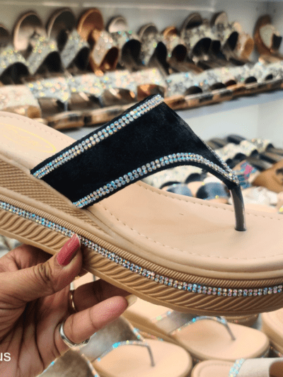 A stylish women’s platform sandal with Open Toe Textured, cushioned footbed, and rhinestone-embellished sole, displayed in a footwear store.