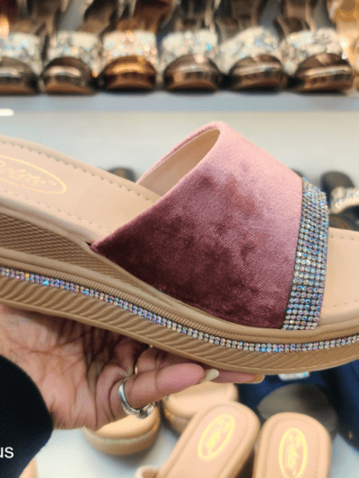 A stylish women’s platform sandal with Open Toe Textured, cushioned footbed, and rhinestone-embellished sole, displayed in a footwear store.