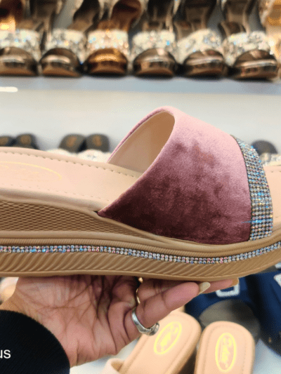 A stylish women’s platform sandal with Open Toe Textured, cushioned footbed, and rhinestone-embellished sole, displayed in a footwear store.